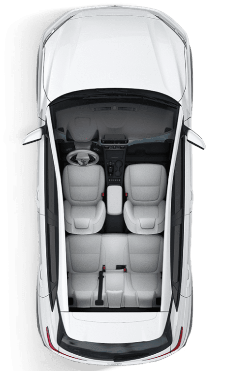 Top-down view of a clean white rental car interior for MJ Adventure Travel